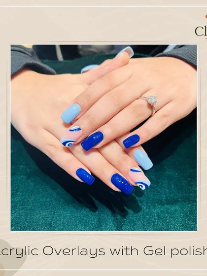 Ward off bad vibes with style. This set of acrylic overlays features a mix of baby blue and electric blue, with trendy swirl art and a protective evil eye design.