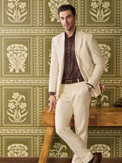 My ivory Irish linen suit, styled with a printed shirt for a relaxed yet dapper look. The neutral color makes it incredibly versatile for any summer occasion.