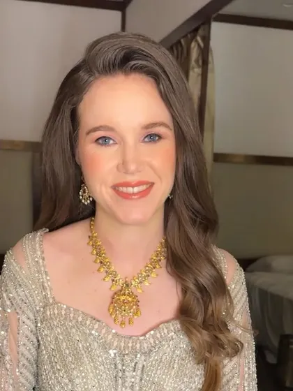 A beautiful portrait of Sarah in her elegant silver-grey lehenga. The makeup is soft and luminous, perfect for an evening reception.