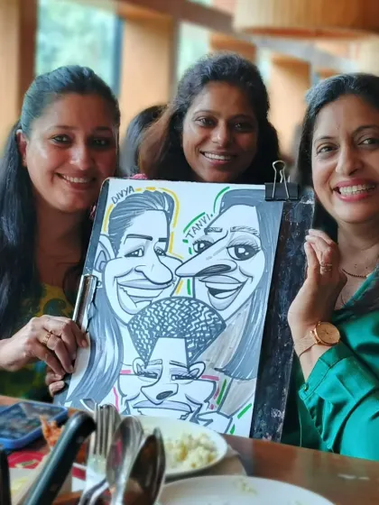 A group of friends enjoying their caricature together. It's a fun way to remember a great time spent with friends at a Sunday brunch.