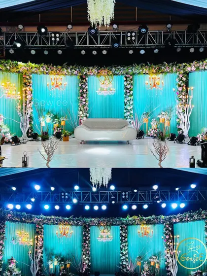 The main stage and a wider view of the turquoise-themed reception decor.