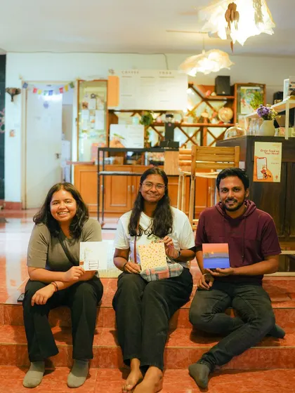 Proud artists with their finished paintings. These events not only raise funds but also help socialize our kittens, preparing them for their future homes.