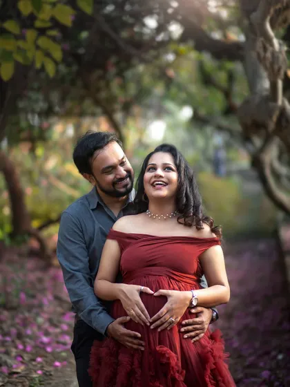 The heart hands pose is a classic for a reason. It's a sweet and direct way to show all the love you have for your baby.