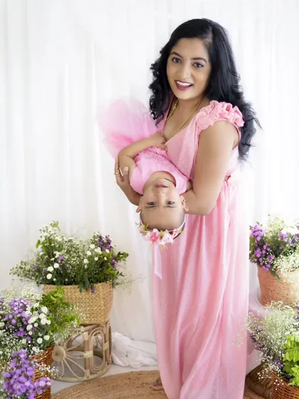 A fun, playful shot with the mother holding her daughter upside down. These are the moments of pure joy.