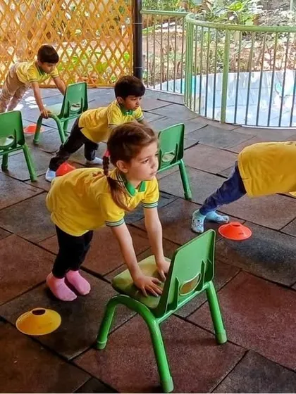 Even our chairs can become part of a fun workout. This creative exercise helps build upper body strength and core stability, turning a simple fitness routine into a playful game.