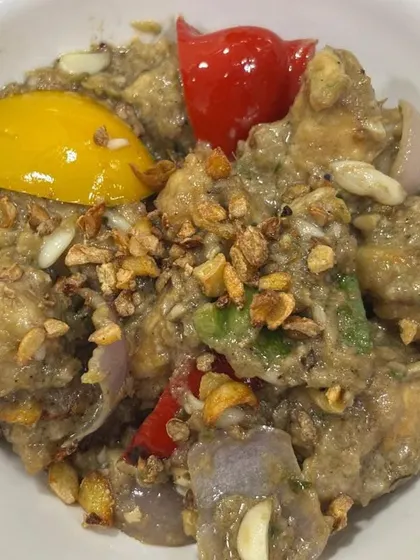 A close-up of our popular Fish Butter Garlic starter. Tender pieces of fish are cooked in a creamy, garlicky sauce with bell peppers, offering a perfect balance of flavours.