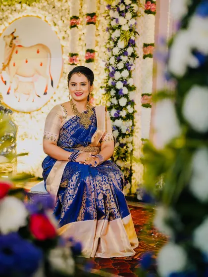 A candid shot of the client enjoying the wedding festivities, looking graceful in her custom-designed ethnic wear.