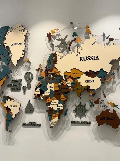 The world map mural with the backlights off. This view highlights the different colors and materials used for the countries and the clear acrylic backing.