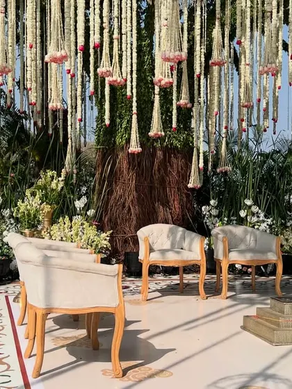 The completed mandap, nestled in nature, with the couple sharing a beautiful moment. This is what makes all the hard work worthwhile.