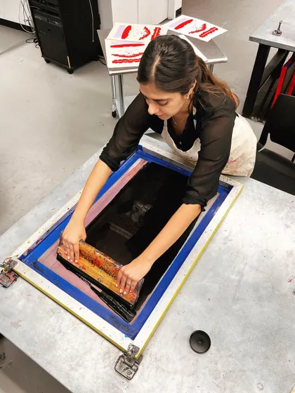 Me in the print shop, screen printing one of the color layers for the Violet Chachki poster.