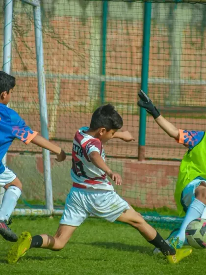 A thrilling goal-line scramble. The excitement in these youth matches is contagious, with players giving their all until the final whistle.