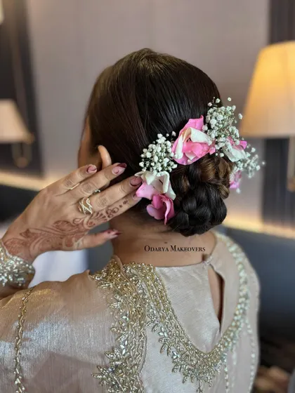 Another view of this beautiful floral bun. It's a perfect hairstyle for a summer wedding.