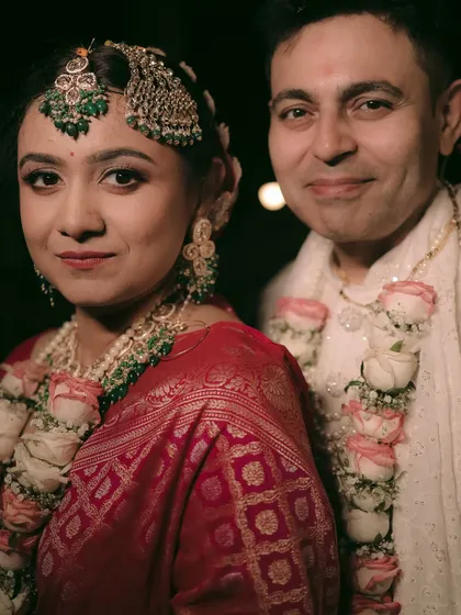 A classic portrait of the newly married couple, capturing their grace and the richness of their wedding attire.