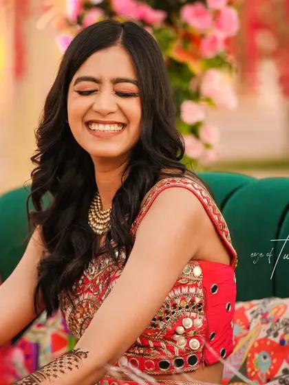 A candid shot of the bride's unrestrained laughter during her Mehendi ceremony. It's my job to be ready for these fleeting moments of pure happiness.