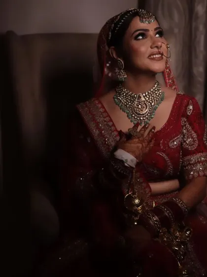 A dreamy, candid shot of my bride looking up with a happy smile. The soft lighting makes her glow.