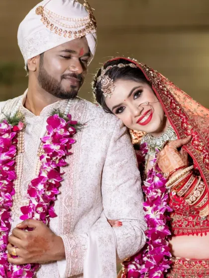 A sweet and romantic pose with the bride resting her head on the groom's shoulder.