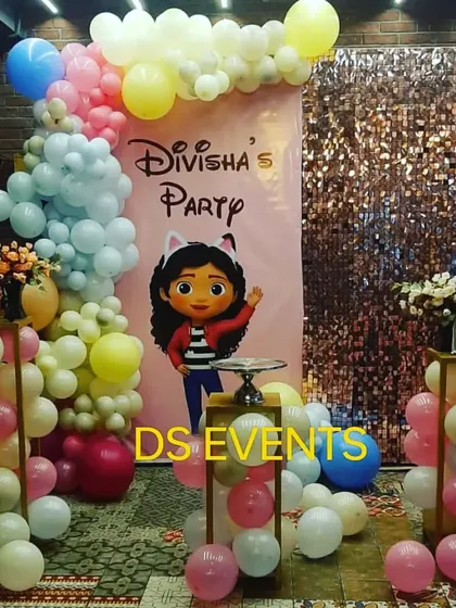 This party is based on the popular Gabby's Dollhouse show. It features a custom character backdrop, a pastel balloon garland, and a shimmering sequin wall, creating a playful and magical atmosphere for the celebration.