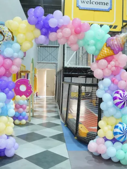 A sweet Candyland theme! This party features donut and ice cream balloons, a pastel color palette, and candy-striped details for a truly delicious celebration.