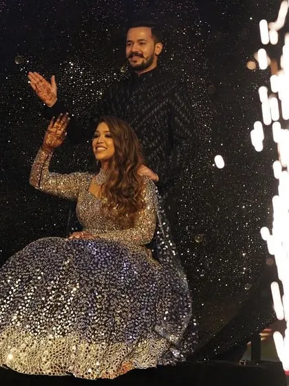 A unique sangeet entry for the couple. We designed this glittering crescent moon prop for the couple to make a dramatic and memorable entrance onto the stage.