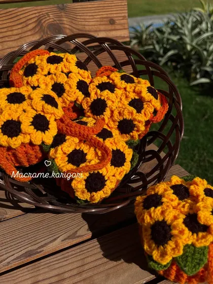 A basket full of our sunflower pot charms, ready for an exhibition. The bright orange pot and sunny flowers are always a crowd-pleaser.