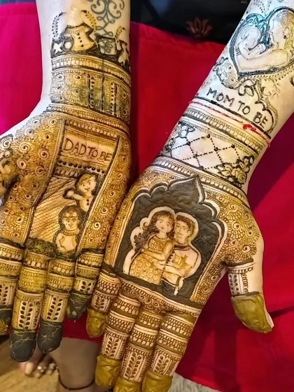 A highly personalized baby shower mehendi. I incorporated a portrait of the couple, the words 'Mom to be' and 'Dad to be', and even drawings of their other children to celebrate the growing family.