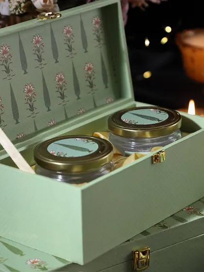 Our floral-themed box with two jars of treats, Rose Petal Cashews and Mini Butter Cookies, makes for a beautiful and tasty Diwali gift.