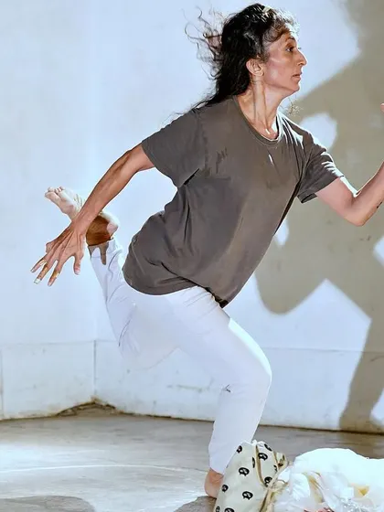 A photograph from my solo performance, "DANDYLION." The shadow work here explores the relationship between our physical form and the ephemeral traces we leave behind.
