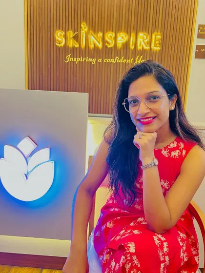 This is me, Dr. Manisha, at our clinic. Our motto is to inspire confidence by making your skincare journey simple, effective, and minimalistic. We believe healthy, glowing skin is a necessity, not a luxury.
