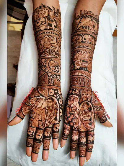 This design blends divine love with the couple's story. It features Radha and Krishna alongside the bride and groom's portraits, surrounded by traditional motifs like elephants and paisleys.