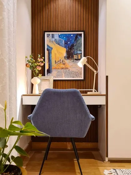 I love finding clever ways to incorporate a workspace. In the Breeze Home master bedroom, I tucked this home office setup into a small nook. The floating desk was created by repurposing our client's old table, and the wood-paneled wall adds warmth and texture.