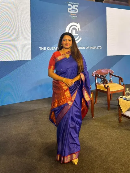 A full-length view of my attire and stage presence at the CCIL 25th Commemorative Event. I believe in dressing for the occasion, and for this high-profile government and corporate gathering, a formal and elegant look was essential to complement the stature of the event.