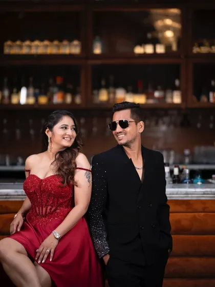 A beautiful, happy moment between the couple. Her makeup features a soft, dewy finish that looks fresh and radiant, proving that cocktail glam can still feel natural and effortless.