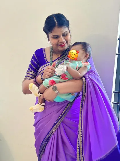 A heartwarming picture of our client with her baby, glowing in our Mysore crepe silk saree. It's moments like these that make my work so fulfilling.