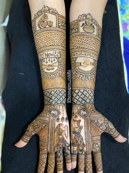 Intricacy at its finest. This bridal henna features the varmala ceremony on the palms, with the wedding date and hashtag beautifully integrated into the design on the forearms.
