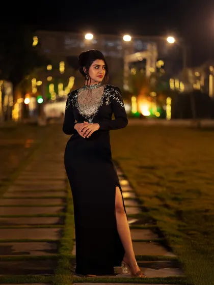 Capturing the perfect moment under the lights. This outdoor evening shot of actress Sanjanaa Anand shows my approach to event and lifestyle photography, using ambient lighting to create a moody and elegant portrait.