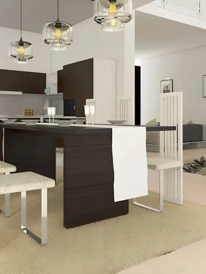 A minimalist dining area in an open-plan loft-style space. The sleek, modern furniture and neutral colors create a very chic and understated look.