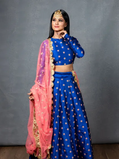 The actress strikes a pose, showcasing the full effect of the glam look. My goal was to create a look that felt both powerful and elegant, fitting for a professional photoshoot.