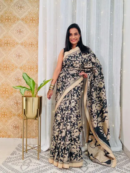 This black and beige printed art silk saree is a sophisticated choice for the office. It's from Amazon for just 699 and is very easy to maintain.