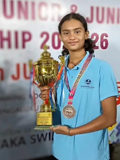 Janya B.S with her trophy and medal.