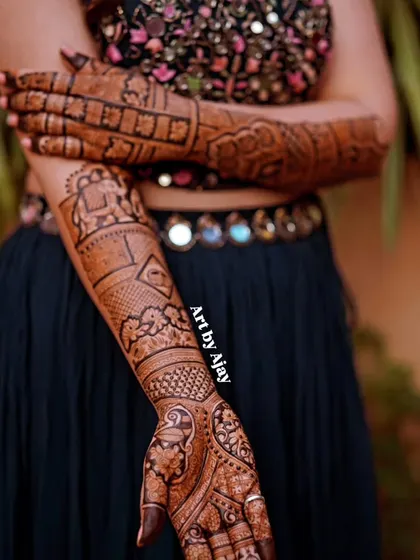 A close-up of a bridal arm design featuring an elephant motif inside a decorative frame, showcasing traditional Rajasthani art.