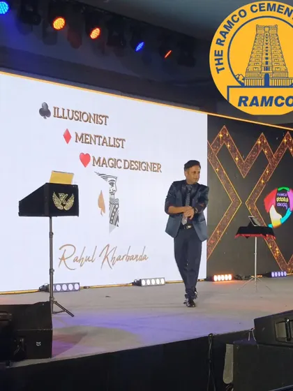 On stage for Ramco Cements in Phuket. My show, featuring my signature "Illusionist, Mentalist, Magic Designer" backdrop, combined interactive mind-reading with digital magic.