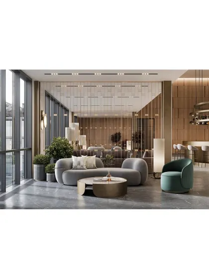 We designed this lounge area with curved, contemporary furniture and floor-to-ceiling windows to maximize natural light. The mix of soft grey and green tones with metallic accents creates a chic and refreshing ambiance.