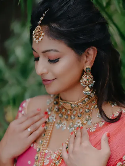 In a vibrant half-saree, she effortlessly blends playful glam with South Indian tradition. Her natural makeup and flowing waves enhance her charm.