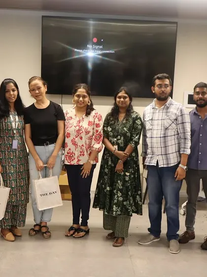A small group from the HBC corporate workshop posing for a photo after their candle making session.