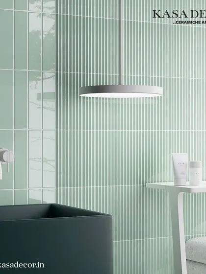 Our 'Costa Nova' fluted tiles in a serene mint green, used here in a bathroom setting. The texture adds a subtle decorative element while maintaining a clean, fresh, and modern aesthetic.