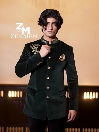 A confident pose in the emerald velvet bandhgala. This piece is designed for a man who appreciates timeless style with a touch of opulence.