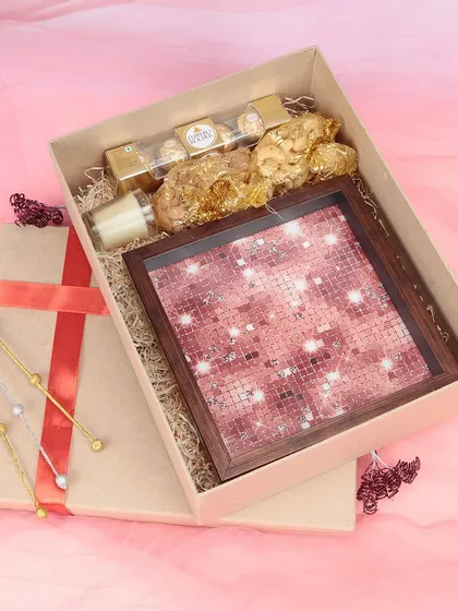 We capture the appeal of festive and luxury gift hampers. This photograph of a gift box containing chocolates and a decorative tray is styled to evoke a sense of celebration, perfect for seasonal marketing campaigns.
