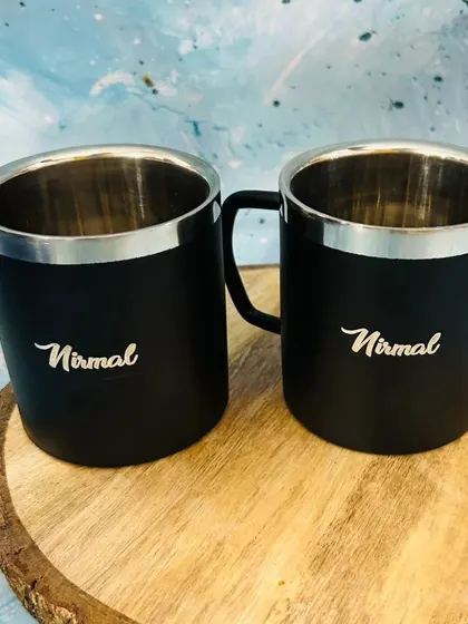A set of two personalized stainless steel mugs. The double-wall construction helps keep your tea or coffee warm, and the black matte finish is perfect for custom engraving.