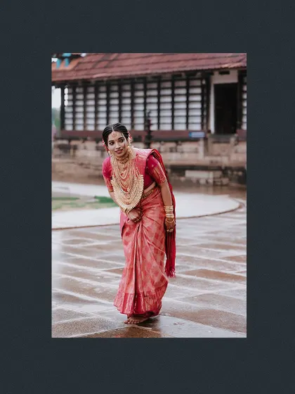 A playful and shy pose from the bride in a traditional courtyard.