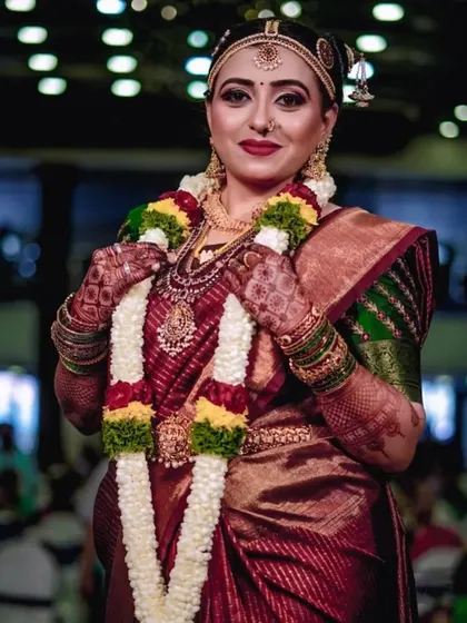 Candid moments from an Iyengar wedding. The bride's makeup is traditional and flawless, designed to last through all the smiles and rituals of the day.